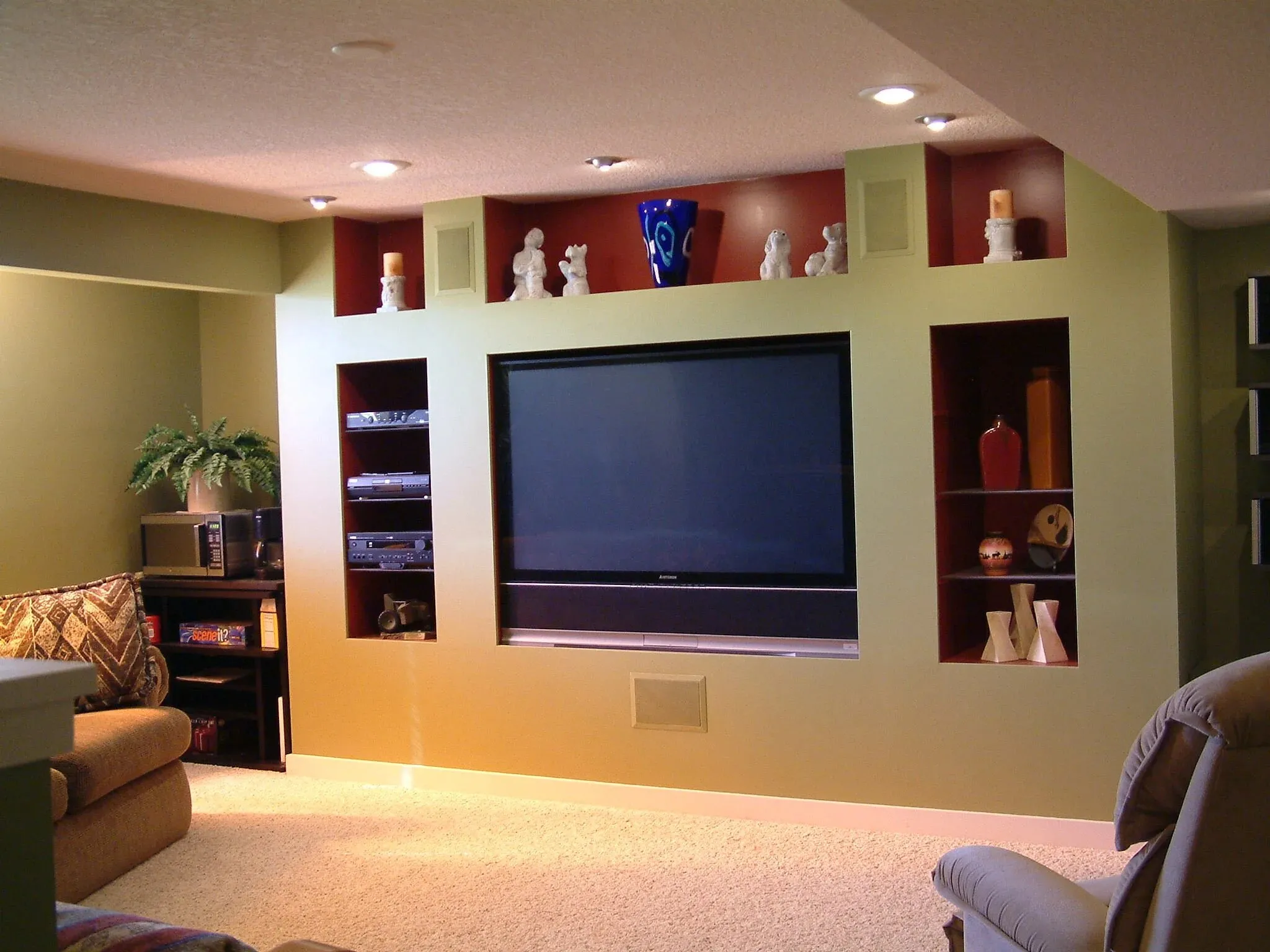 Media wall with built-in shelving and display niches