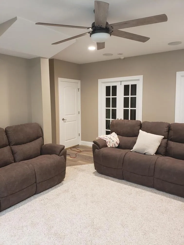 Two reclining sofas in the finished basement
