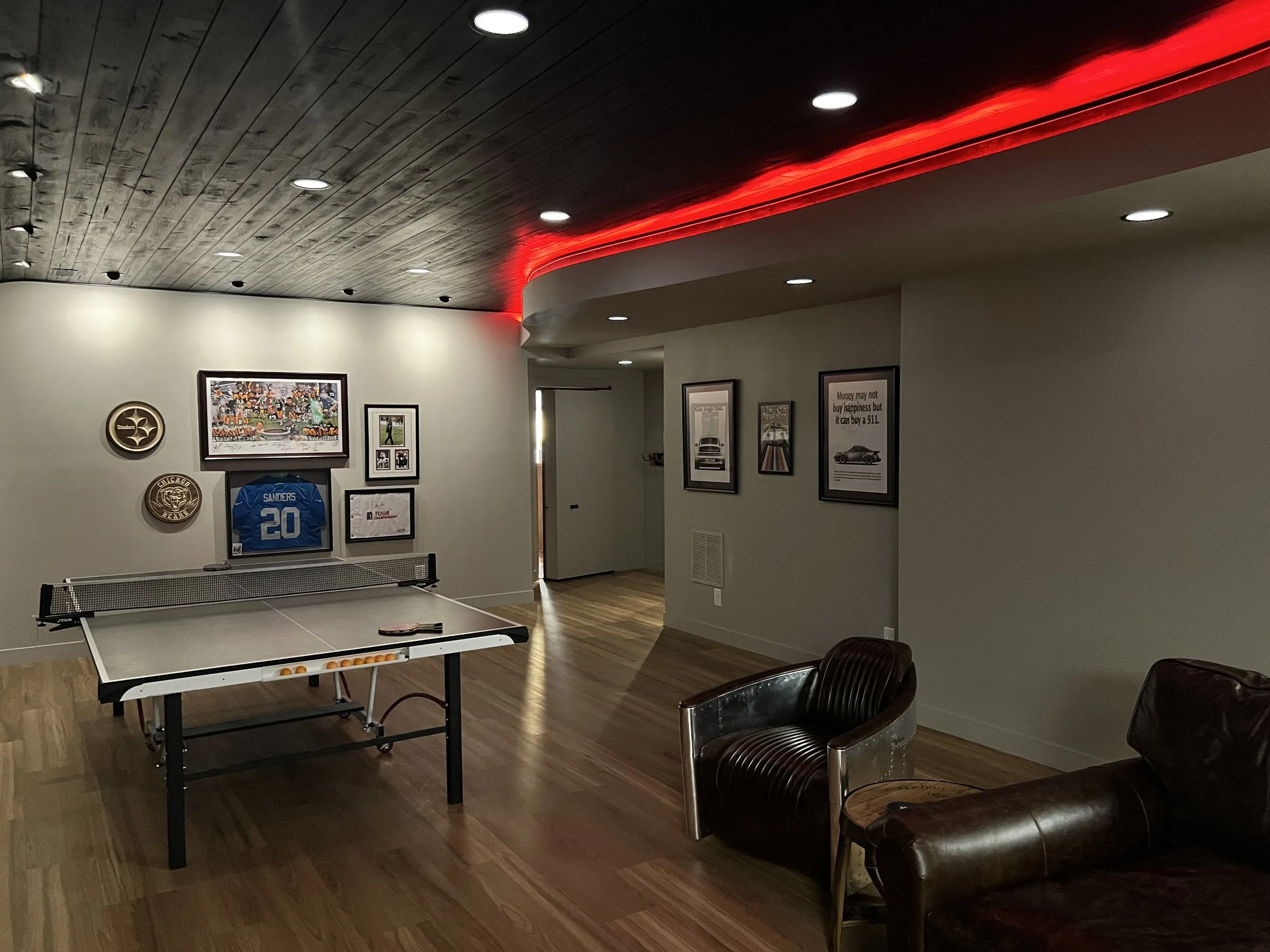 Red LED cove tracing the curved ceiling