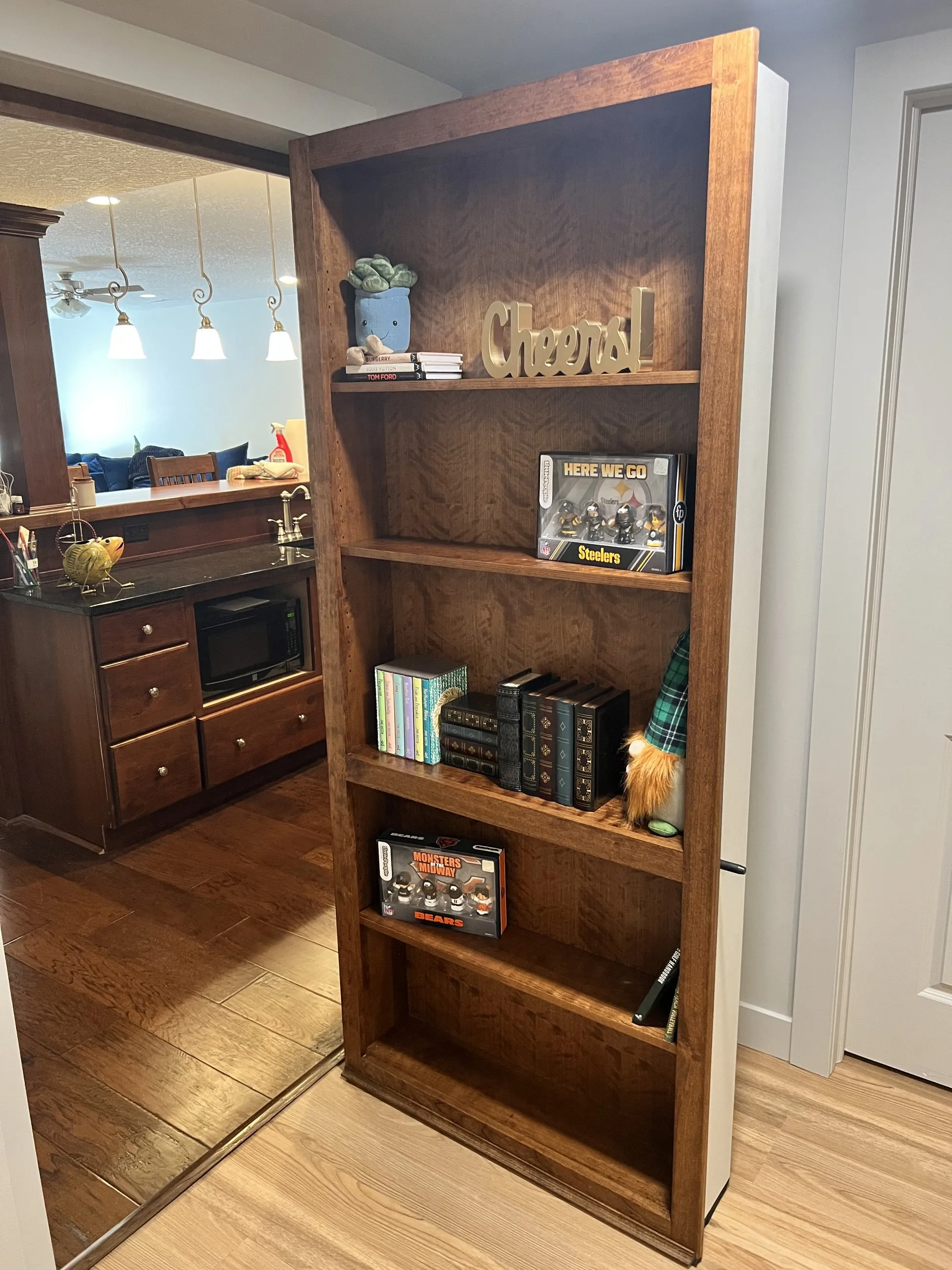 Murphy bookshelf door open to a hidden room