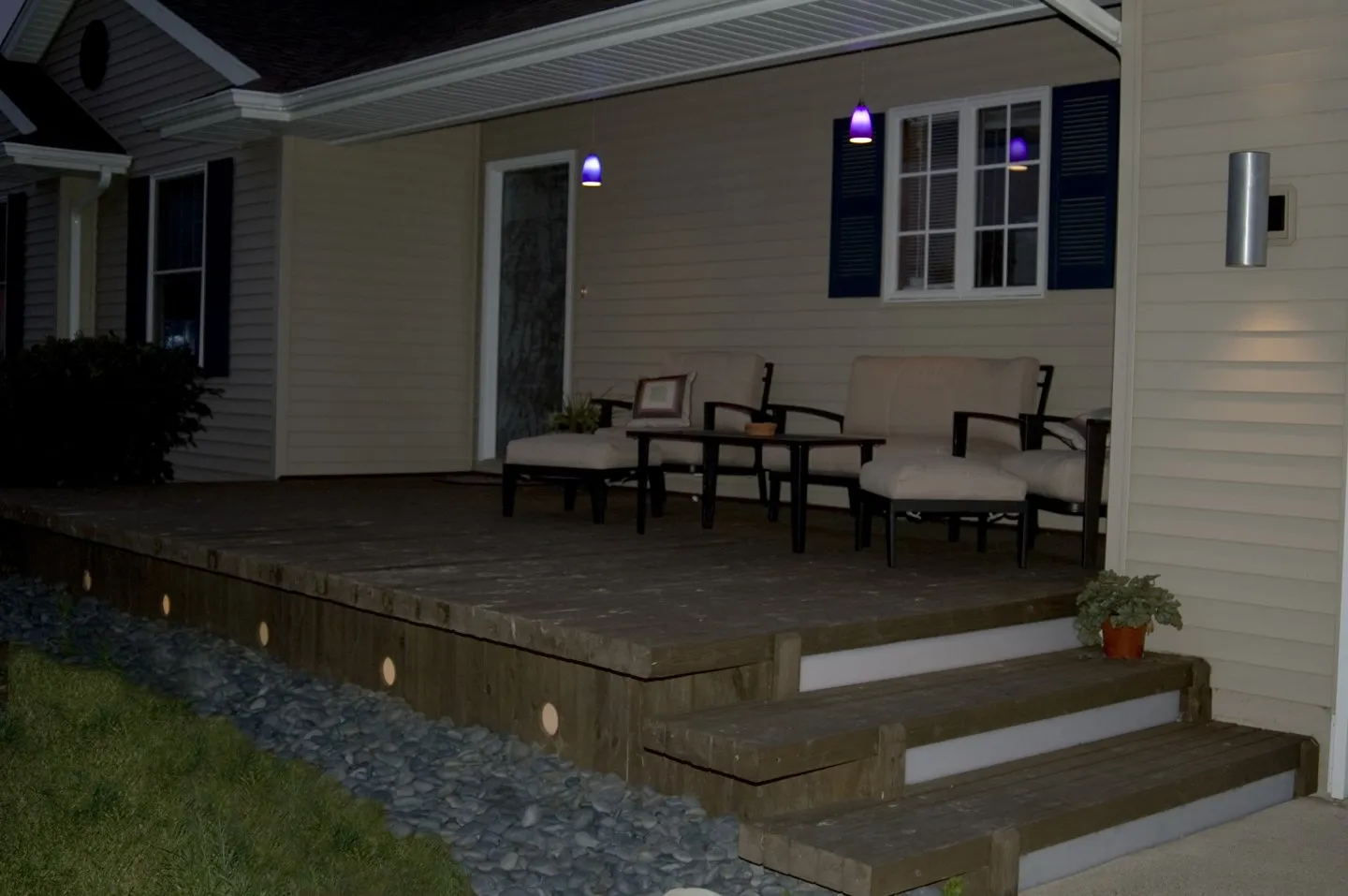 Front deck at dusk with lighted stair risers and skirting