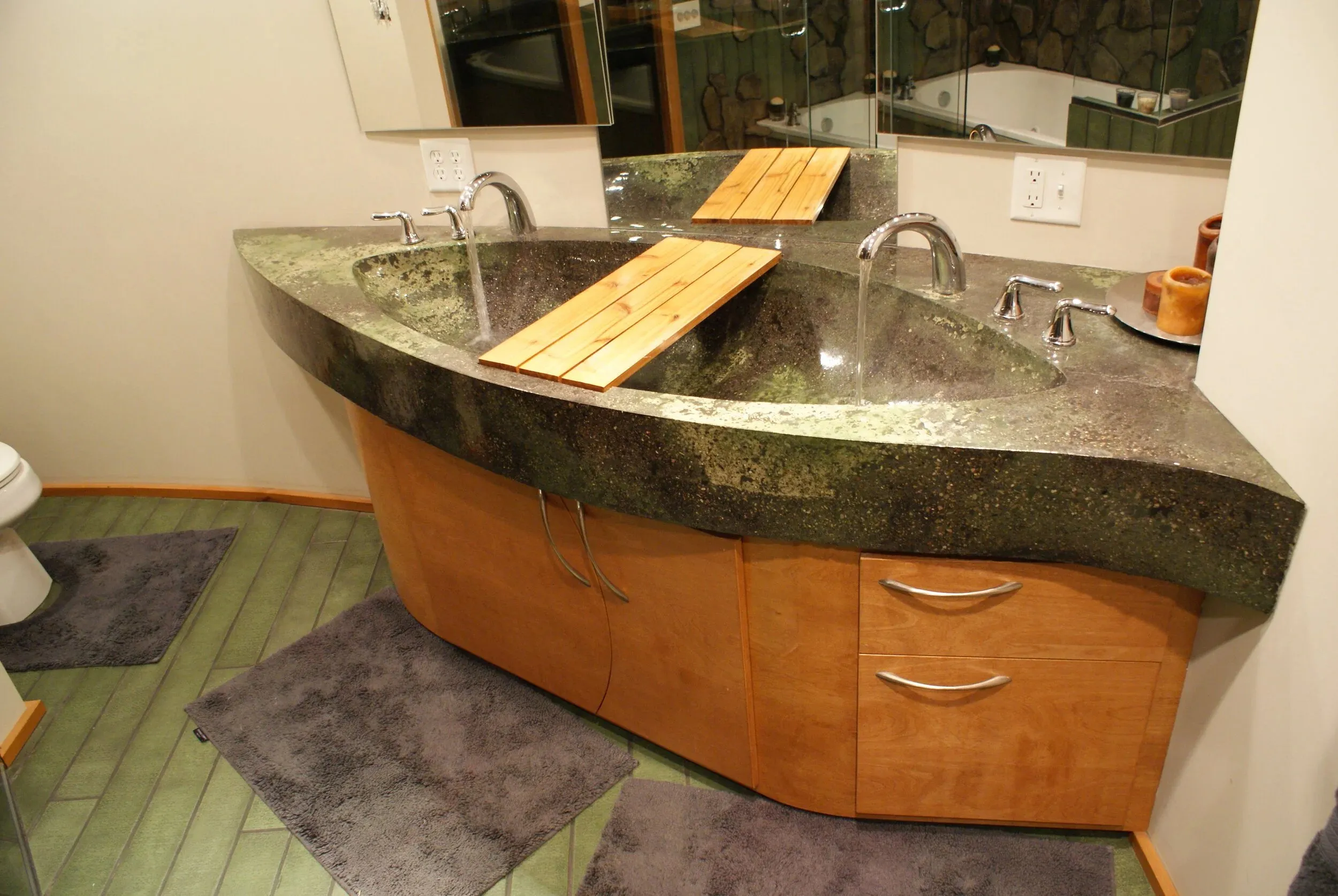 Cast concrete double vanity with curved wood drawers