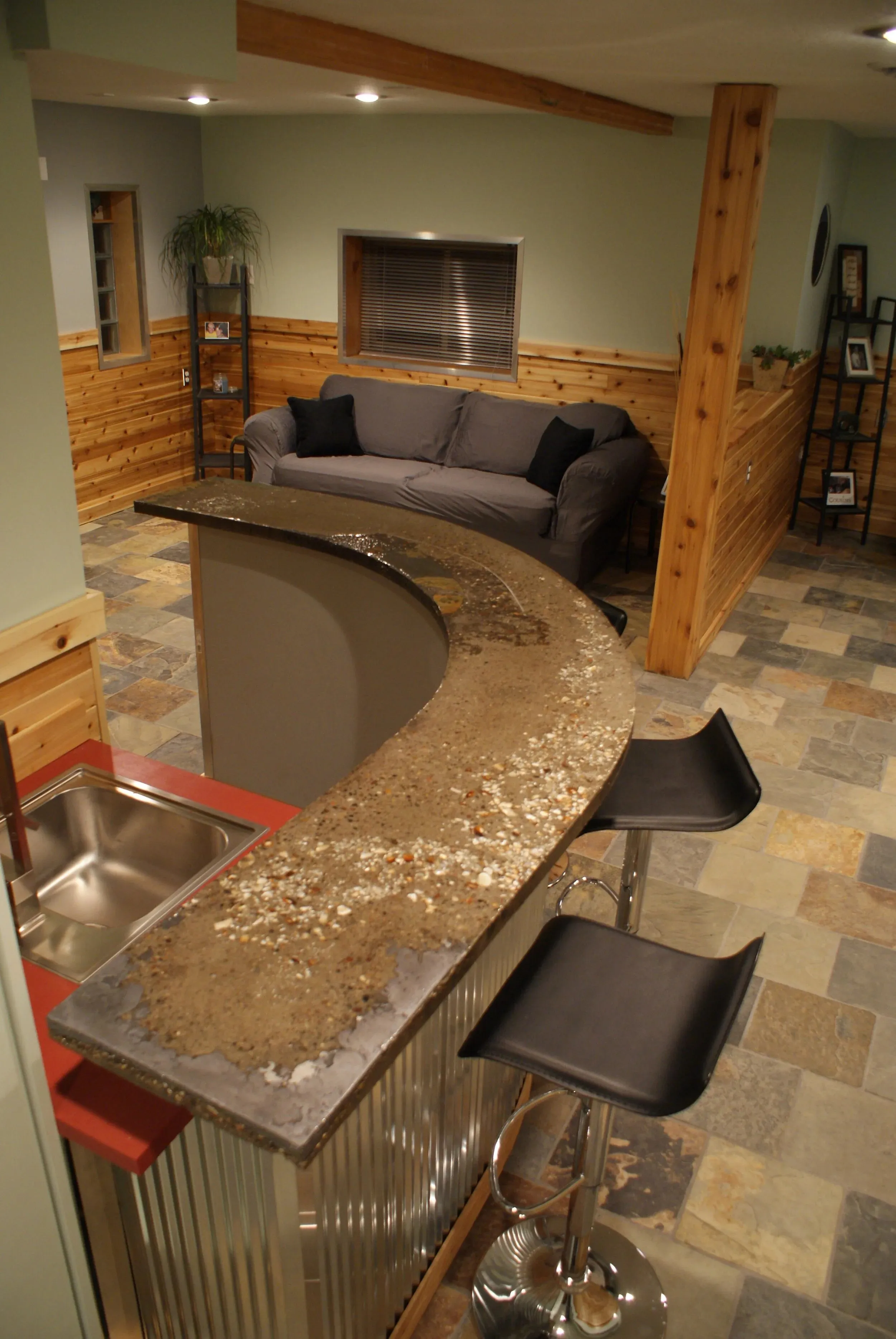 Concrete-topped bar with corrugated metal base