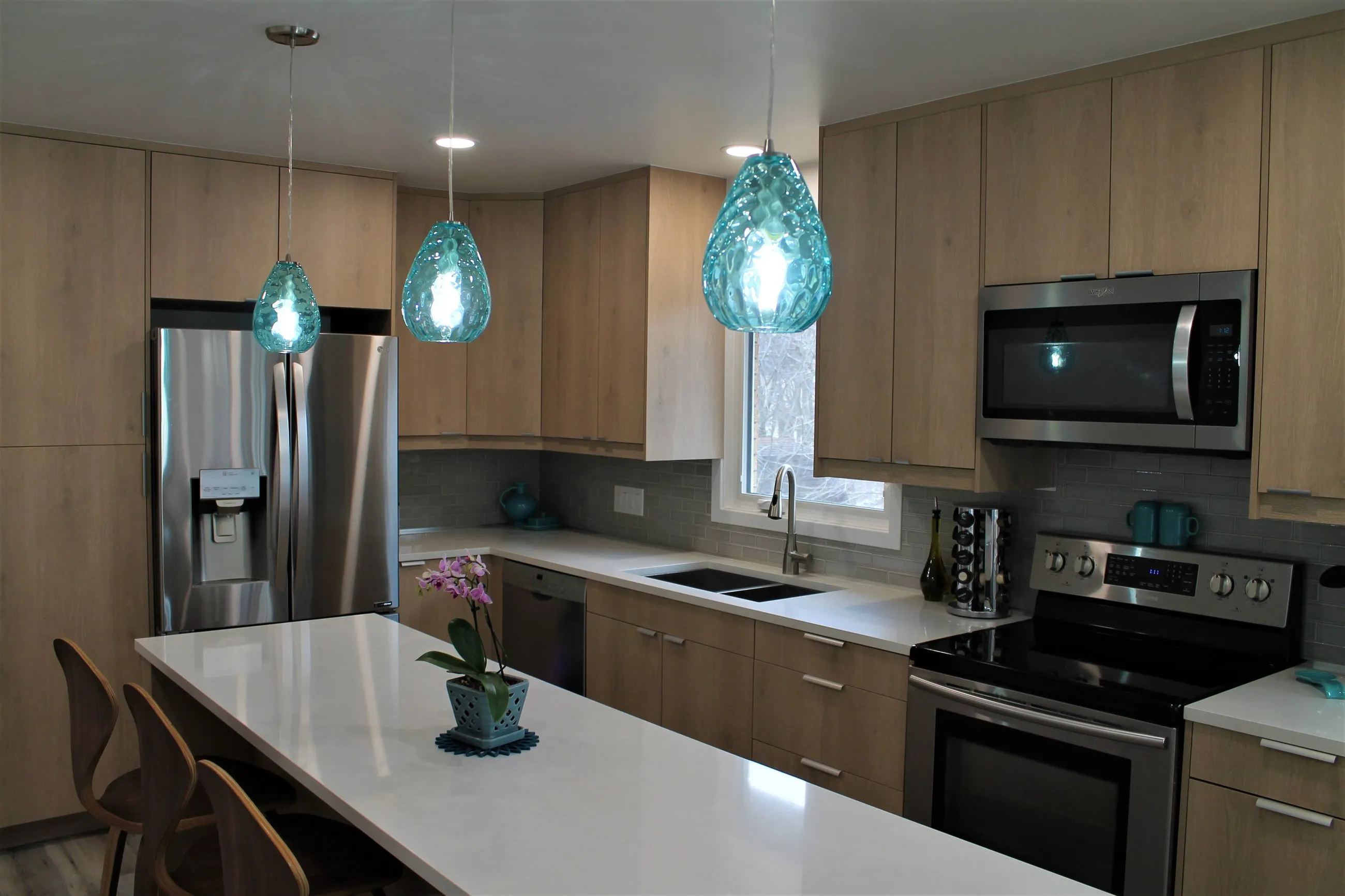 Birch kitchen run with stainless appliances