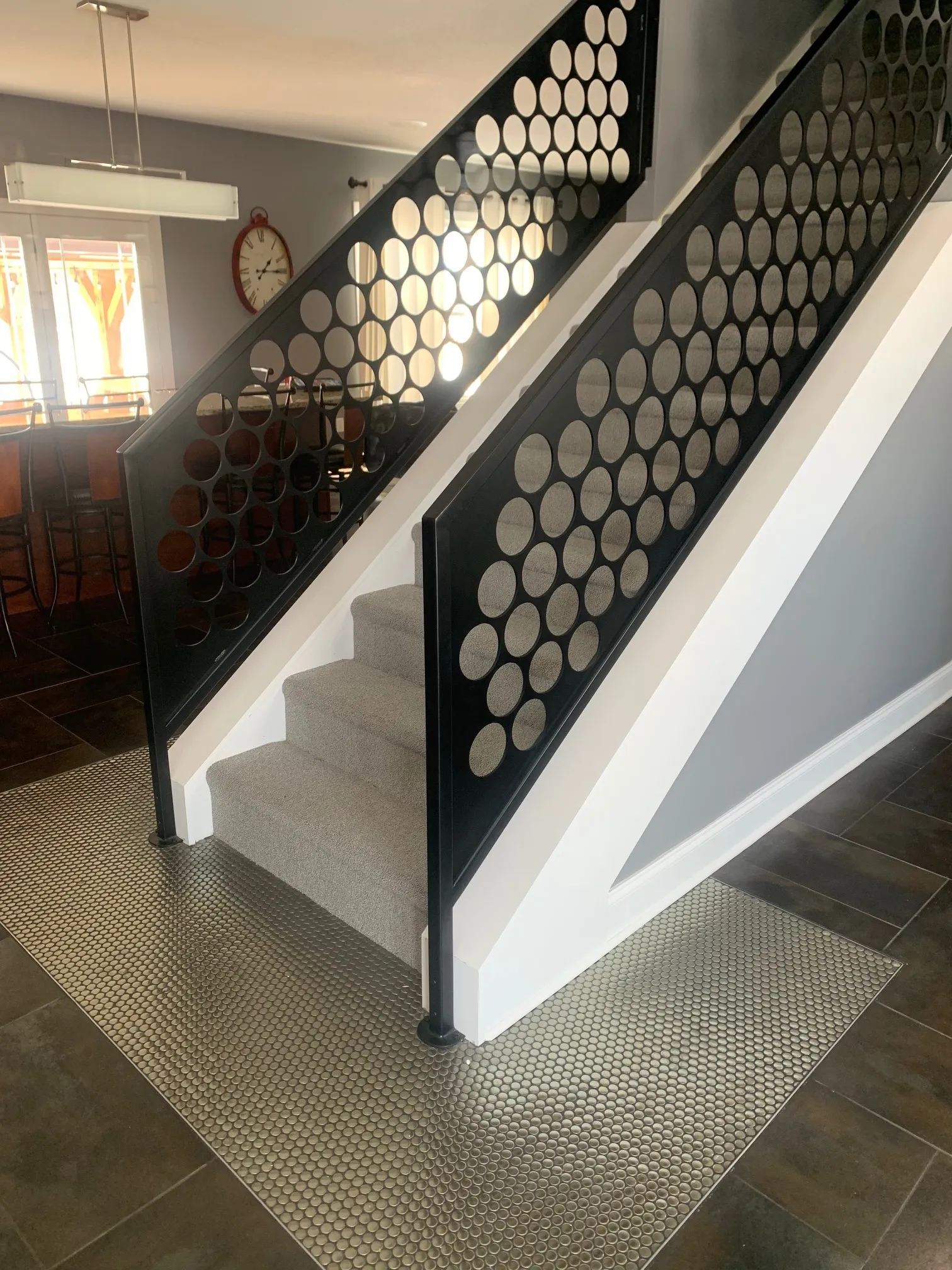Custom stacked-disc metal staircase railing